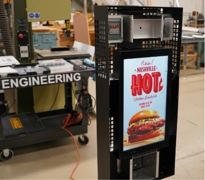 Howard Company 22-inch presell digital menu board on the engineering floor during quality inspection before shipment