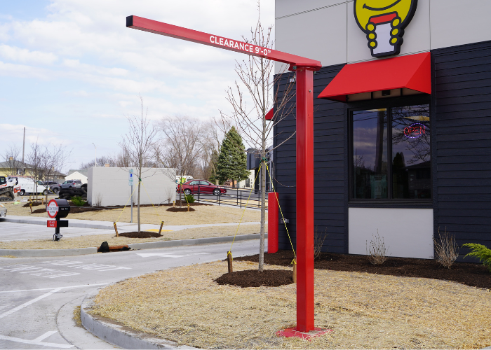Powder-coated steel drive-thru clearance bars from The Howard Company